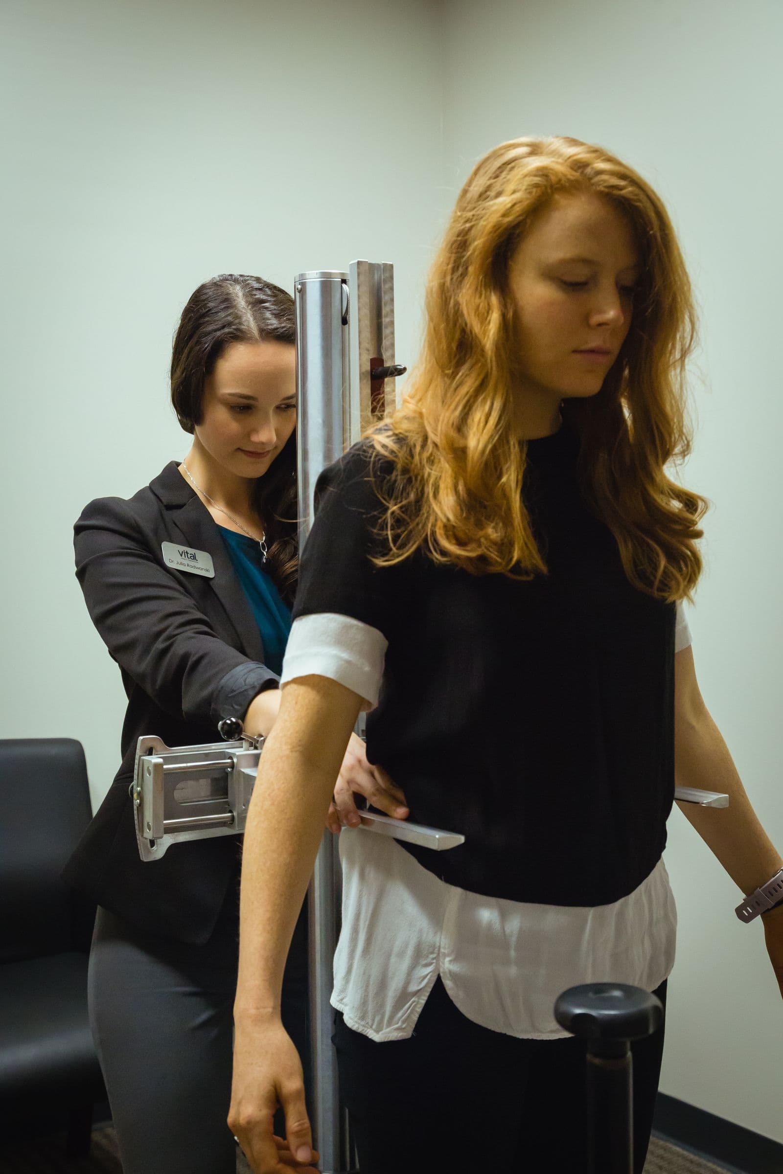 Consultation and postural examination at Vital Brain & Spine