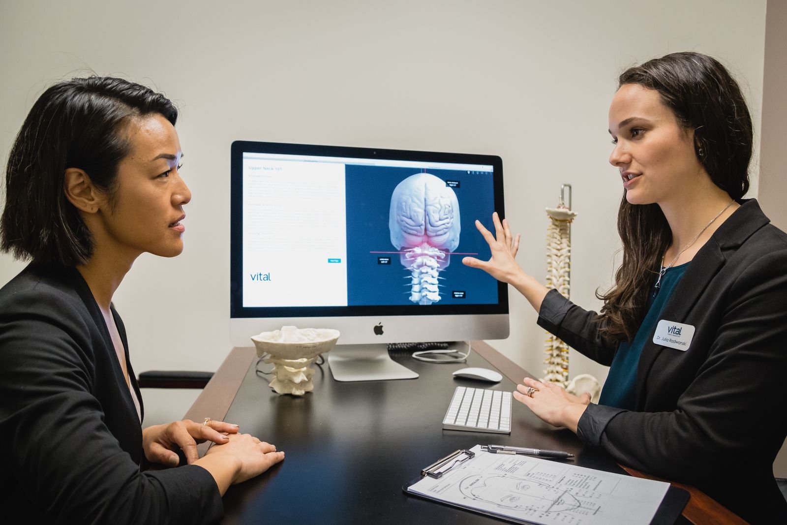 Dr. Julia Radwanski performing a gentle, precise NUCCA upper cervical assessment